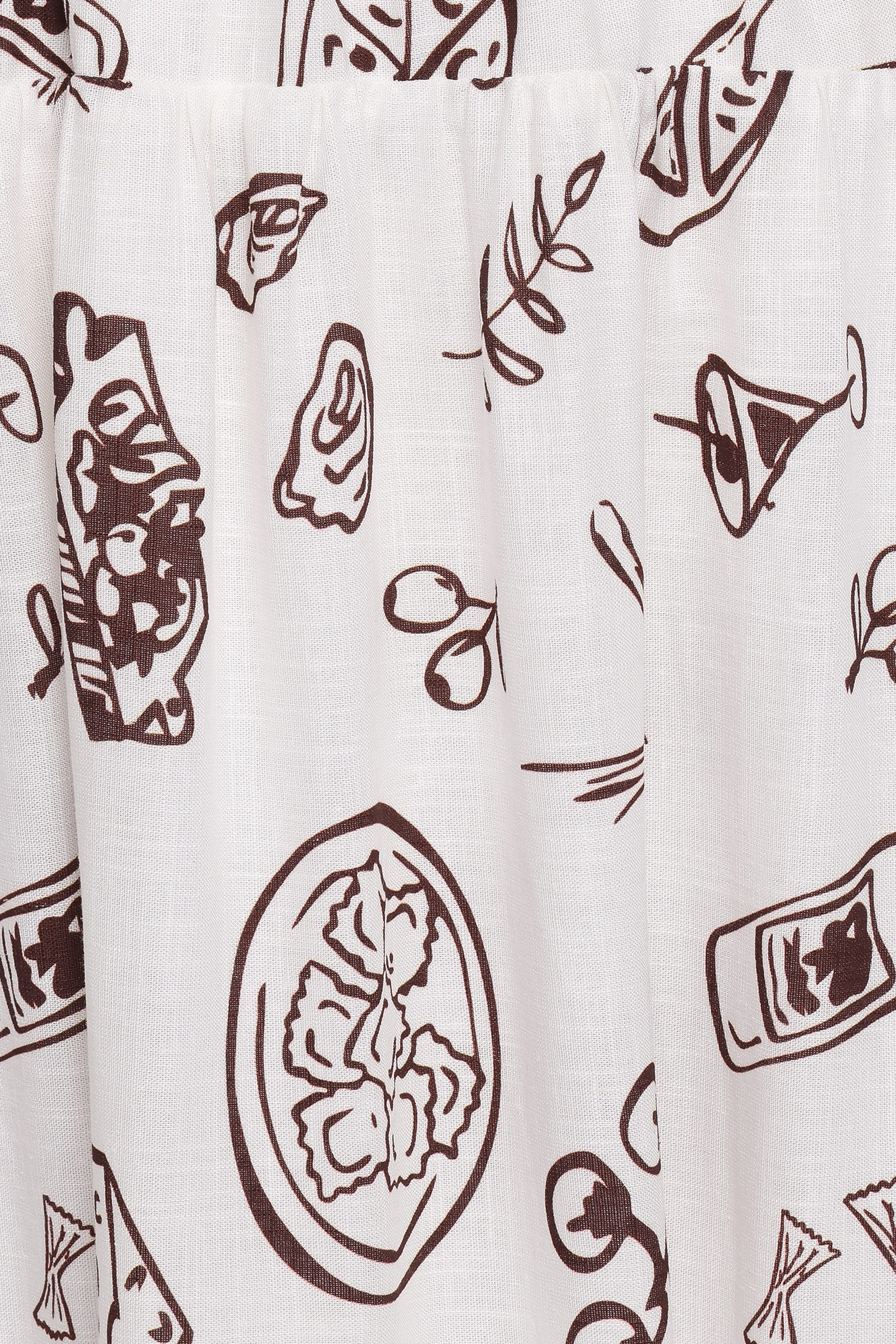 Curtain with brown cocktail-themed pattern on a white background