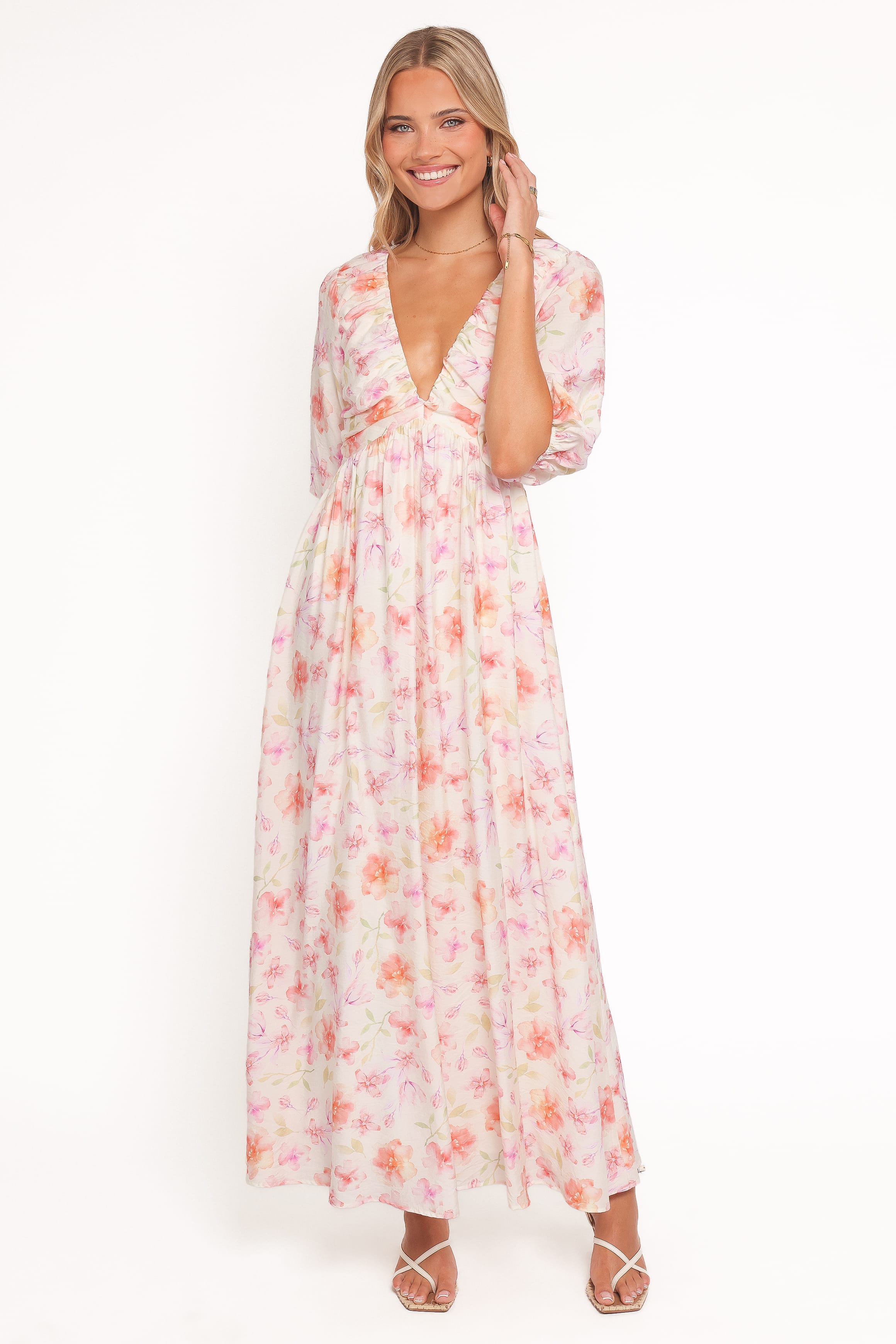 Woman wearing a floral dress on a white background