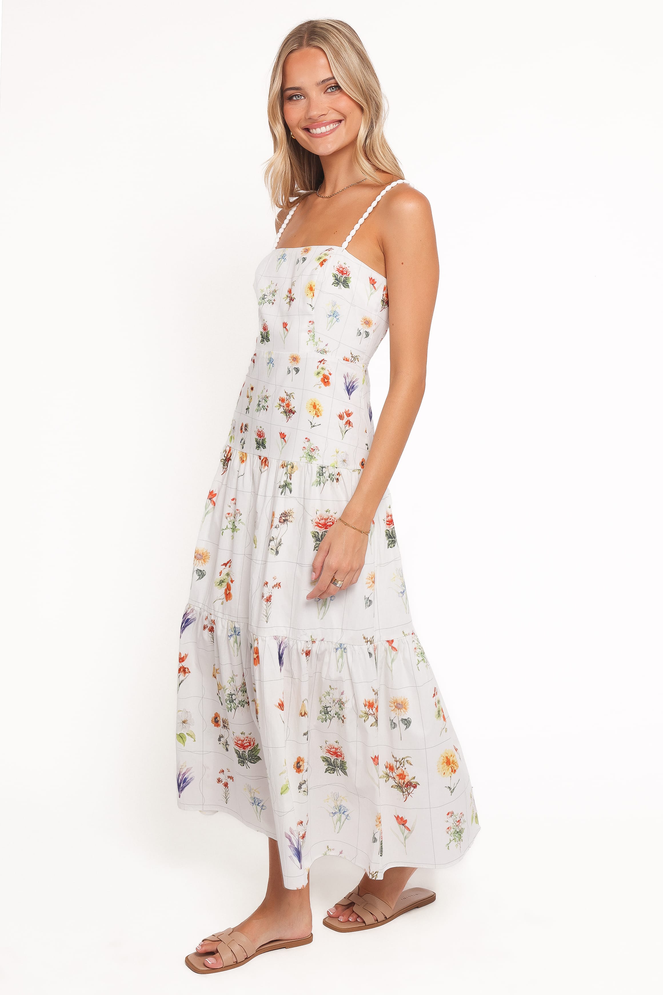 Woman wearing a floral dress on a white background
