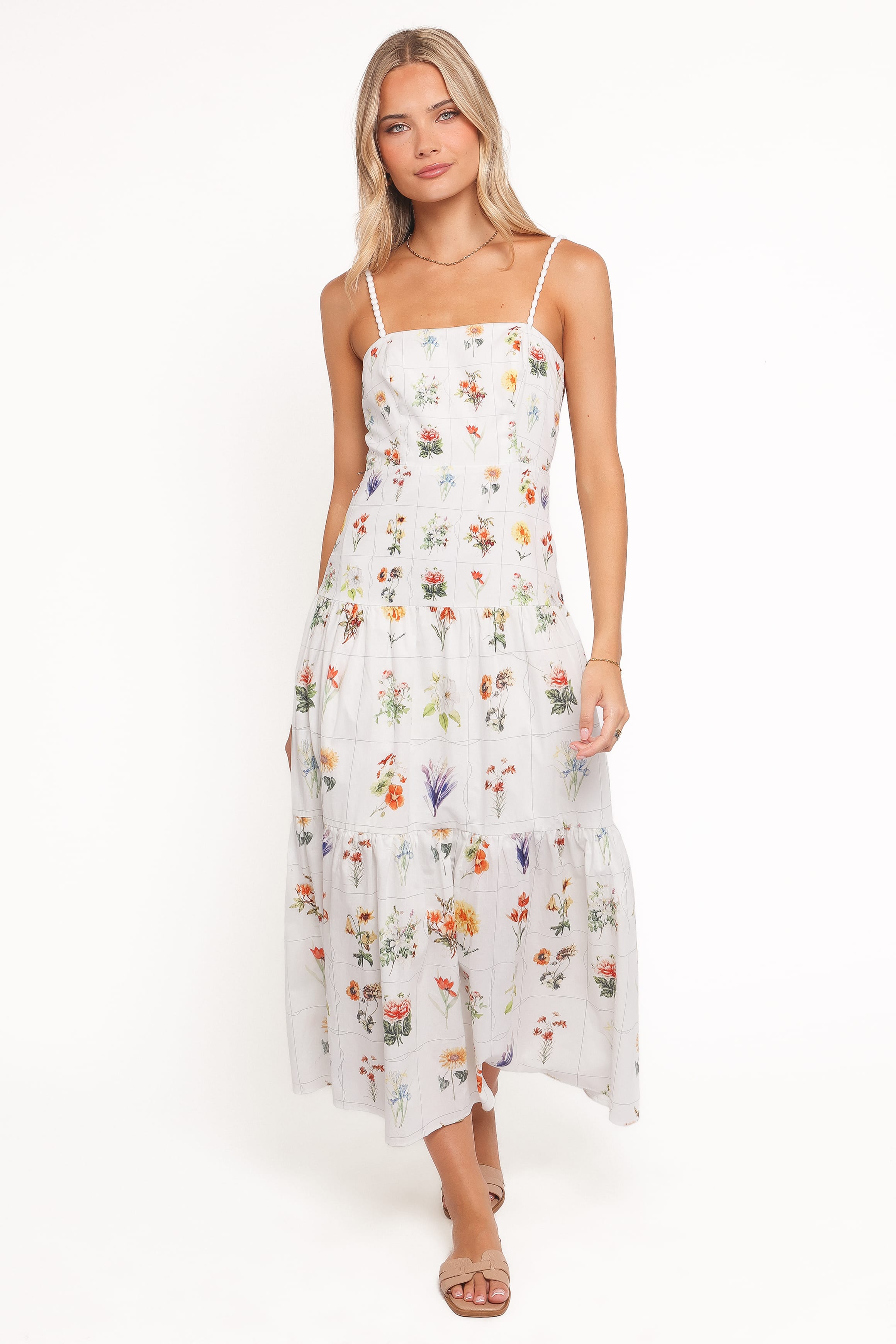 Woman wearing a floral dress on a white background