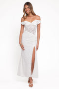Woman wearing a white lace off-shoulder gown on a white background