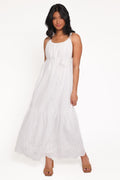 Woman wearing a white sleeveless dress on a white background